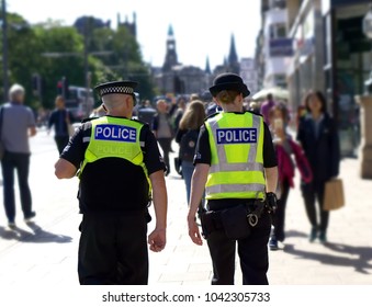 Police Officer On Duty On A City Centre During Special Event.