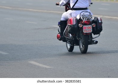 Police Officer Riding Motorcycle. Using Photoshop Write 100 And Phone Symbol.