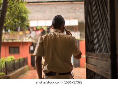 Police Officer Talking On Phone