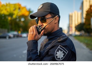 Police Officer Talking On The Radio