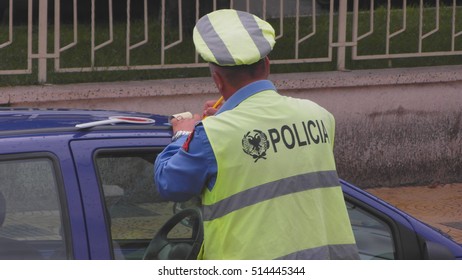 A Police Officer Writes A Fine