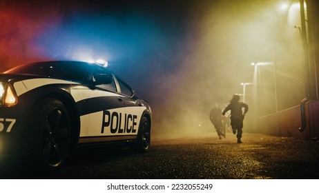 Police Officers Attempting to Arrest a Fleeing Criminal. Cops in Pursuit of a Running Mugger Wanted by Law Enforcement. Police on Duty Keeping the Streets Safe at Night. Camera Focus on Police Car