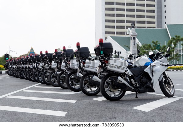 Police officers  motorcycle line up on the road\
in Thailand