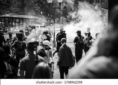 Police Officers In Riot Gear Moving Towards Protesters After Tear Gas Canisters Had Been Used To Disperse Them From The Streets. Columbus, OH 5/30/2020