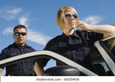 Police Officers Using Two-Way Radio