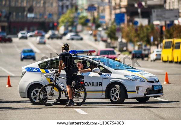 Police on duty. Police and\
bicycle police on duty at city centerof Kyiv. 28 August 2016, Kyiv,\
Ukraine.