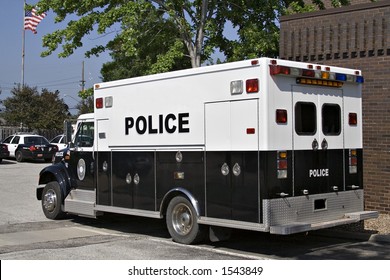 A Police Paddy Wagon Parked Outside The Police Station.