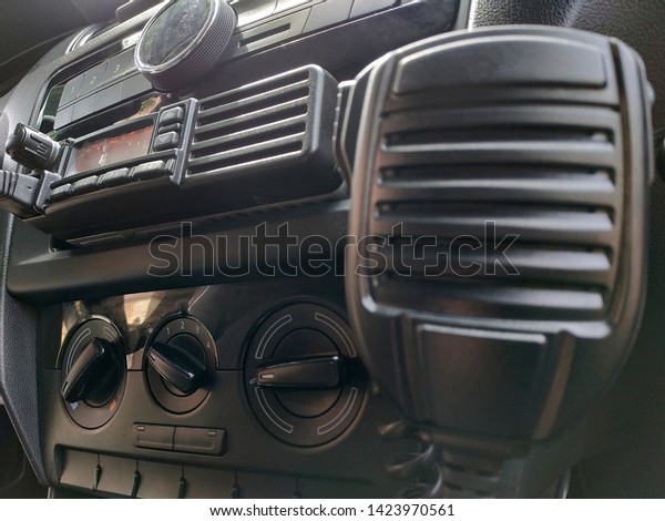 Police patrol car FM radio equipment\
and microphone. Walkie-talkie. Selective focus.\
