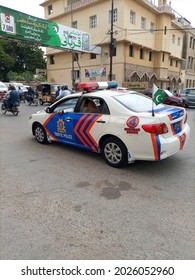 A Police Patrol Car Is Passing In Front Of The City Station . The Signboard Are In Urdu And English Language.   - Karachi Pakistan - Aug 2021