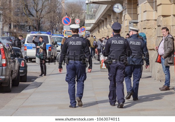 A police patrol patrols the\
central train station in Dresden, Germany, on March 30,\
2018.