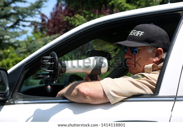 Police\
Radar Trap. A man pretends to be a radar police man while he uses a\
hair dryer as a radar gun. Hair Dryers and Radar Guns can Almost\
look alike but have very different uses. \
\
\
