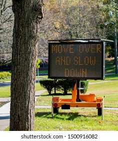 Police Road Sign To Move Over And Slow Down