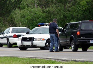 Police Roadblock, Officer Talking To Motorist