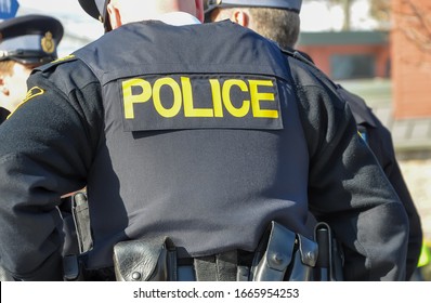 Police sign in the uniform of policeman