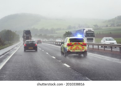 Police siren flashing blue lights driving on motorway to accident or crime scene