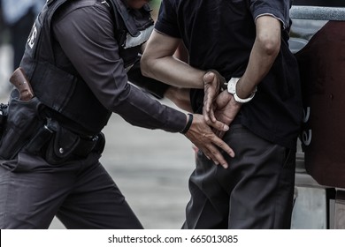 Police steel handcuffs,Police arrested,Professional police officer has to be very strong,Officer Arresting.