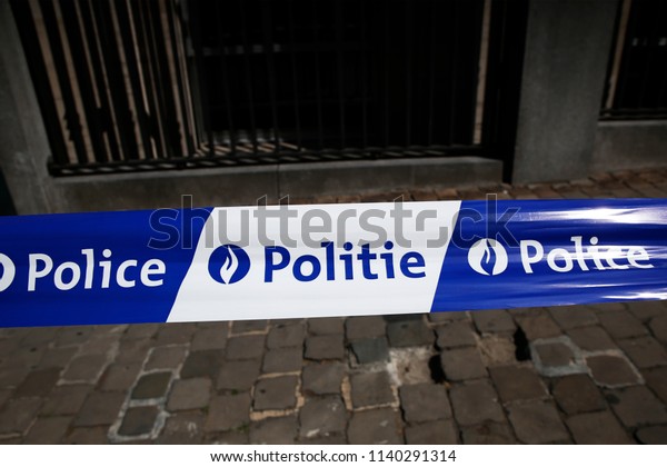 Police\
tape across street close a road near the European Commission\
headquarters in Brussels, Belgium on JuL 21,\
2018