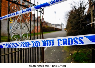 Police Tape Cordons Off The Entrance To A Park