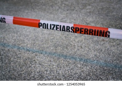 Police Tape With The German Words For Police Tape