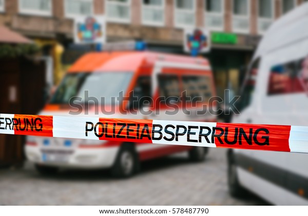 Police tape in Germany at the crime scene
with the inscription in German 