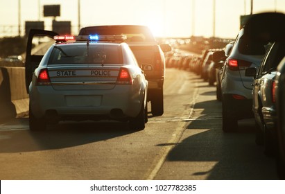 Police Traffic Stop. Policeman Stop Speeding Vehicle On The Side Of The Highway. Chicago, Illinois, USA.