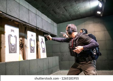 Police Training In Shooting Gallery With Short Weapon.
