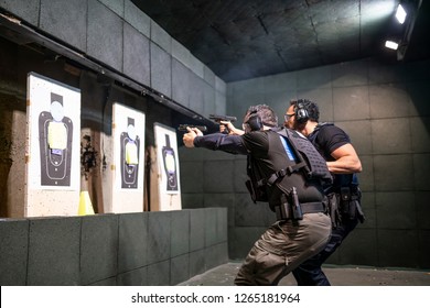 Police Training In Shooting Gallery With Short Weapon.