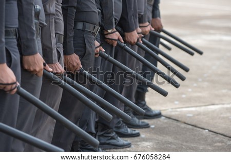 police Training in the use of batons to control crowds.

