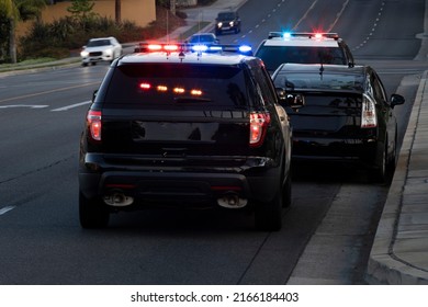 Police Units Pull Over A Car On A City Street.