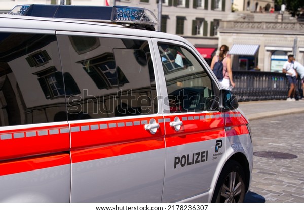Police van of\
cantonal police force of Canton Zürich crossing Minster Bridge at\
the old town of Zürich on a sunny summer day. Photo taken July 2nd,\
2022, Zurich,\
Switzerland.