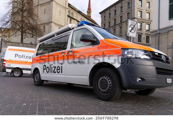 Police vans on bridge of the old town of\
Zürich during police operation at a cloudy autumn afternoon. Photo\
taken November 5th, 2021, Zurich,\
Switzerland.