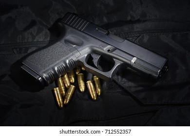 Police weapon and equipment on black uniform background
