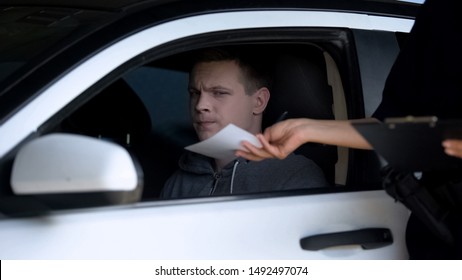 Police Woman Giving Fine Receipt To Driver On Road, Traffic Offence, Inspection