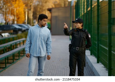 Police Woman Showing Way To Man Passerby