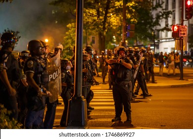 A Policeman Was Aiming To Use Tear Gas.
Many Protesters Gathered Around In Front Of White House In Washington DC On 5/30/2020. No Justice No Peace.