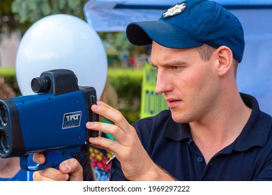 Policeman Applies Laser Speed Gun. Cop Holds TruCAM Radar. Traffic Speed Control Concept. Vinnitsa. Ukraine. 07.20.2019. 