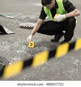 Policeman During Investigation At Road Accident Area