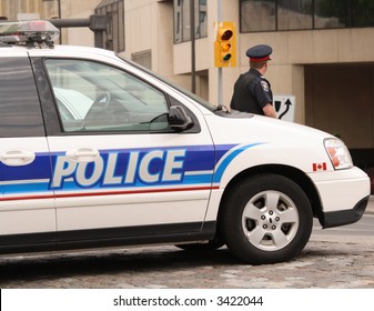 Policeman And Police Vehicles In Downtown Ottawa, Ontario. Canada.