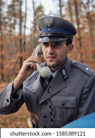 A Policeman Talking On The Phone / Old Polish Milicja - Warsaw Poland 10.12.2019