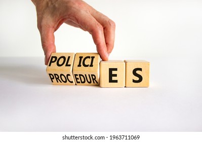 Policies vs procedures symbol. Businessman turns wooden cubes, changes the word 'procedures' to 'policies'. Beautiful white table, white background, copy space. Business, policies, procedures concept. - Shutterstock ID 1963711069