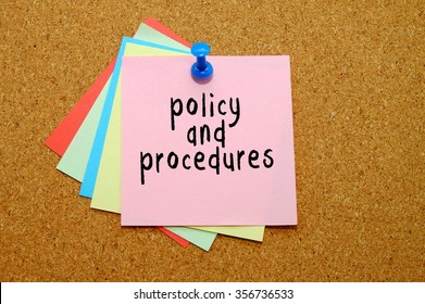 Policy And Procedures Written On Color Sticker Notes Over Cork Board Background.