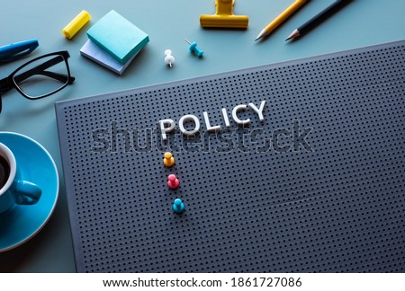 Policy text on desk office.business management and strategy of organization concepts.vision to success