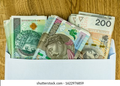 Polish 100, 200 And 500 Zl Banknotes In An Envelope