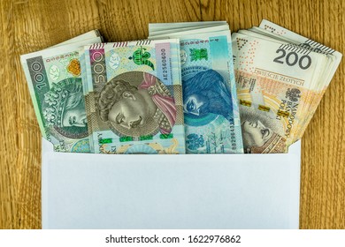 Polish 100, 200 And 500 Zl Banknotes In An Envelope