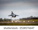 A Polish Air Force Mig-29 Fulcrum fighter taking off on full afterburners, RAF Fairford, Swindon, Gloucestershire, UK