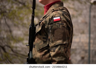 Polish Army Soldier Standing At Attention, Holding A Military Rifle Gun.