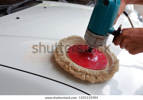 polish a car with auto\
polisher