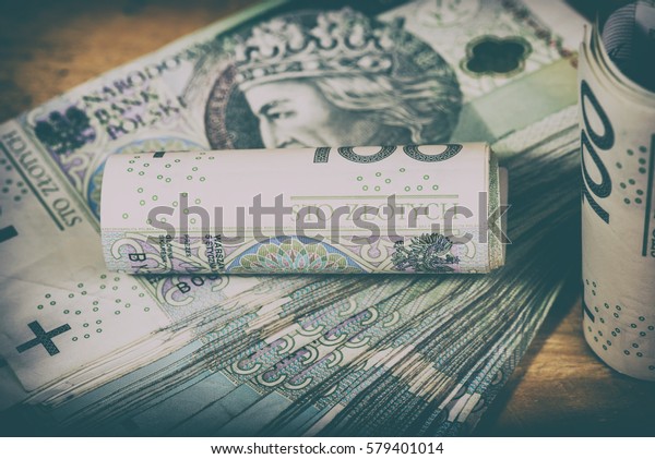 Polish currency PLN, money. File ,roll of\
banknotes of 100 PLN (Polish\
zloty)