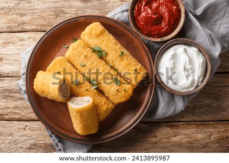 Polish Krokiety or croquettes stuffed with meat closeup on the plate on the wooden table. Horizontal top view from above
 Zdjęcia stock © 