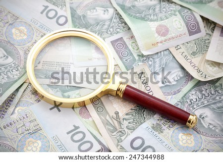 Polish money with golden magnifying glass